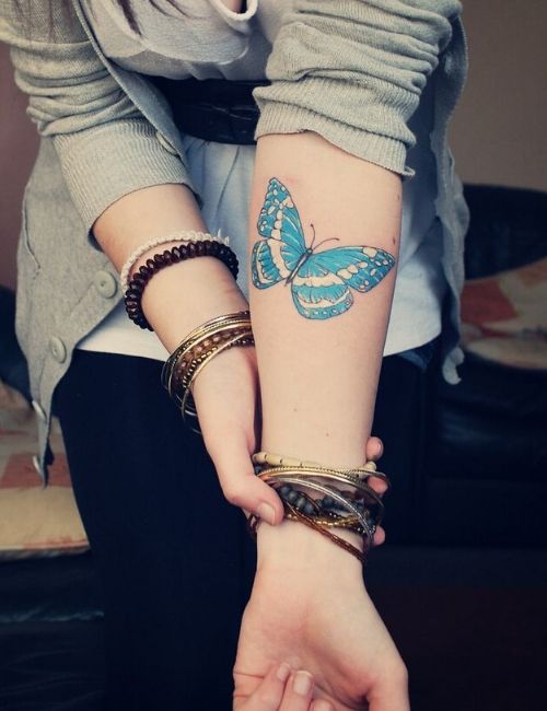 Butterfly tattoo on girl arm