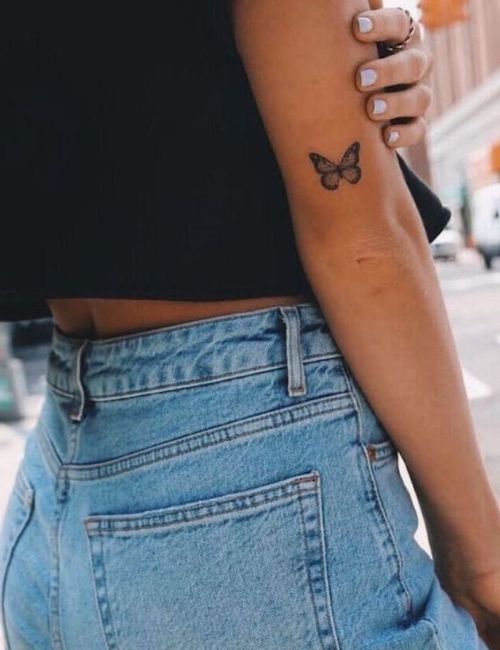 small tattoo on left elbow