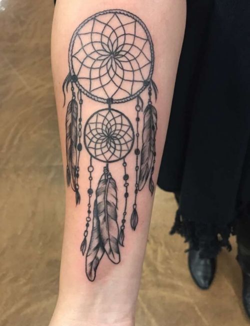 Dream catcher tattoo on forearm