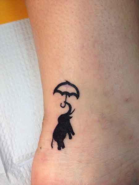 Black-Elepahnt-And-Simple-Umbrella-Tattoo-On-Ankle