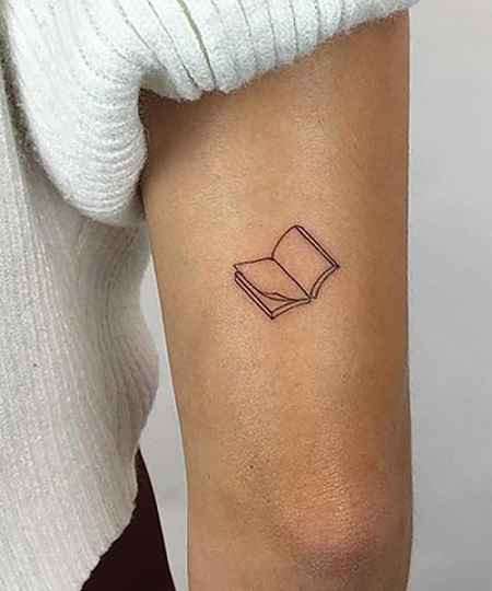 book tatoo on arms